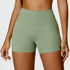 High-Waisted Tummy Control Yoga Shorts in peach, designed for fitness with a lift-booty feature and a sleek, flattering fit.