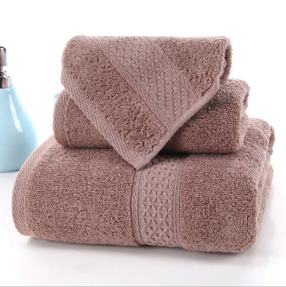 3-Piece Premium 100% Cotton Bath & Hand Towel Set in soft brown, featuring textured patterns and a plush finish.