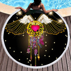 Round Boho Beach Towel featuring a colorful dreamcatcher design with wings and feathers, perfect for yoga or beach use.