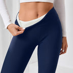 High-waisted navy leggings with a fleece lining, ideal for winter and yoga, shown being pulled down to reveal the soft interi