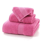 3-Piece Premium 100% Cotton Bath & Hand Towel Set in vibrant pink, featuring plush texture and decorative borders.