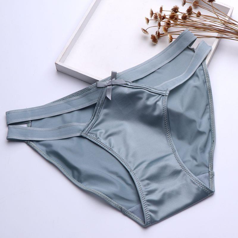 Satin Milk Silk girl underwear in light blue, featuring a hollow butterfly knot design and seamless, low-waist triangle cut.