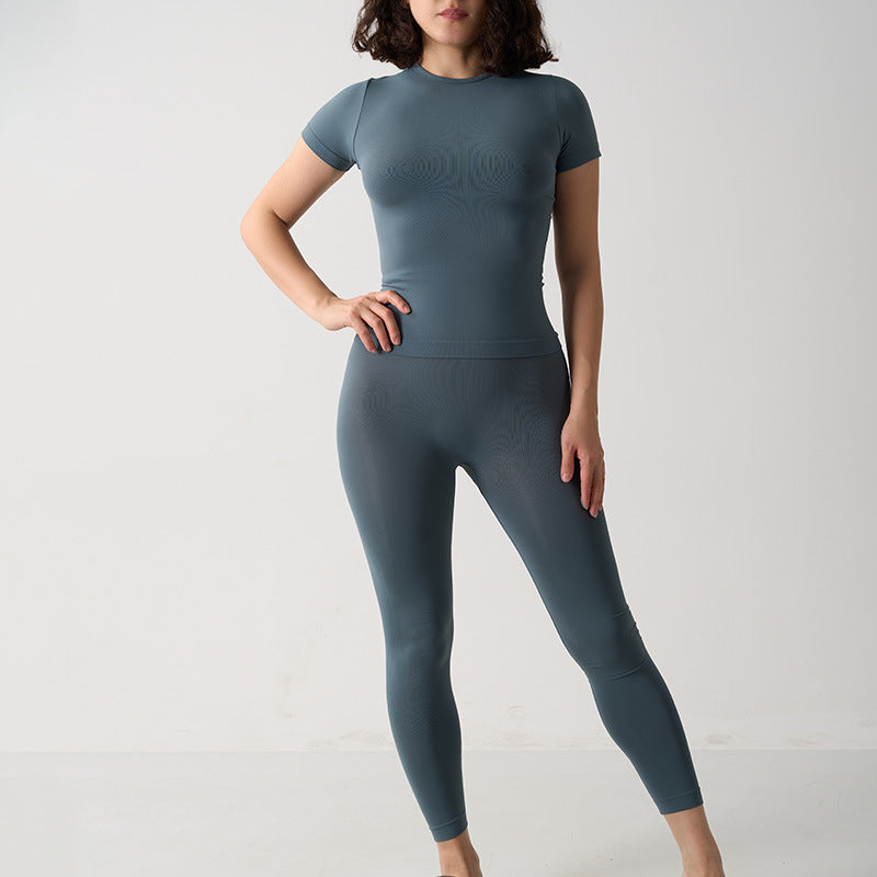 Seamless 2-Piece Activewear Set featuring a short sleeve sport t-shirt and long leggings in a muted blue color.