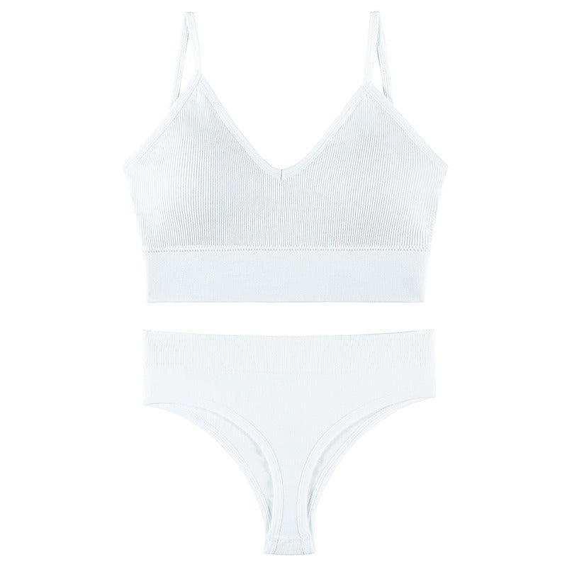 White gathered bra and matching thong set with thin triangle cups and adjustable straps, designed for comfort and style.