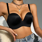 Black Women's Seamless Anti-Slip Gathered Comfort Bra with a plunging neckline and adjustable straps, styled with denim short