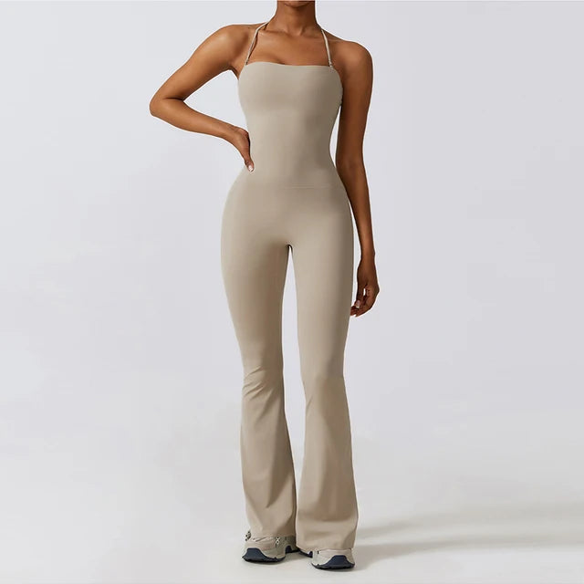 Beige bell bottoms gym set for women, featuring a one-piece yoga suit with flare leggings and a fitted bodice.