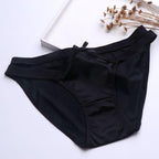Black satin milk silk girl underwear featuring a sexy hollow butterfly knot design, seamless and hip-hugging low waist triang