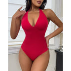 Red Bodyshaper Thong Bodysuit by classyfashionz featuring a seamless design, deep V-neck, and tummy control for shaping.