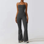 Gray bell bottoms gym set for women, featuring a one-piece yoga suit with flare leggings and a fitted bodice.