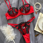 Red sheer mesh lingerie set with floral embroidery on a model.