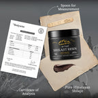 Shilajit resin dissolving in a glass of warm water for daily wellness.