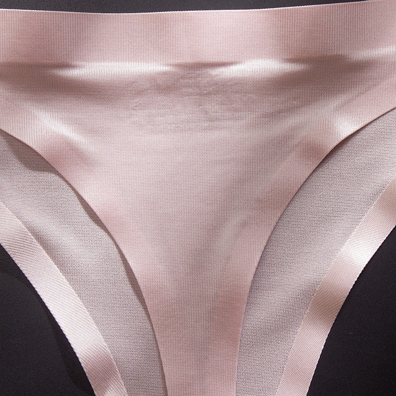 Pink low waist seamless G-string briefs made of transparent ice silk fabric, featuring a smooth, sleek design.
