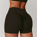 High-Waisted Tummy Control Yoga Shorts in black, featuring a ruched design for a flattering fit and enhanced silhouette.