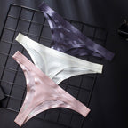 Three pairs of women's low waist G-string briefs in pink, white, and dark purple, made from transparent ice silk material.
