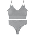 Gray gathered bra and matching underwear set with thin triangle cups and a sporty design, perfect for comfort and style.