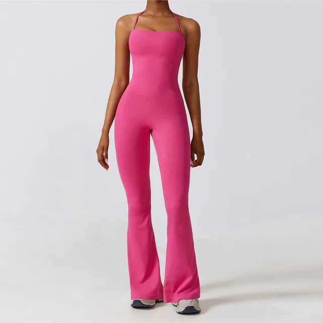 Pink bell bottoms gym set for women, featuring a one-piece yoga suit with a fitted bodice and flared legs. Ideal for workouts