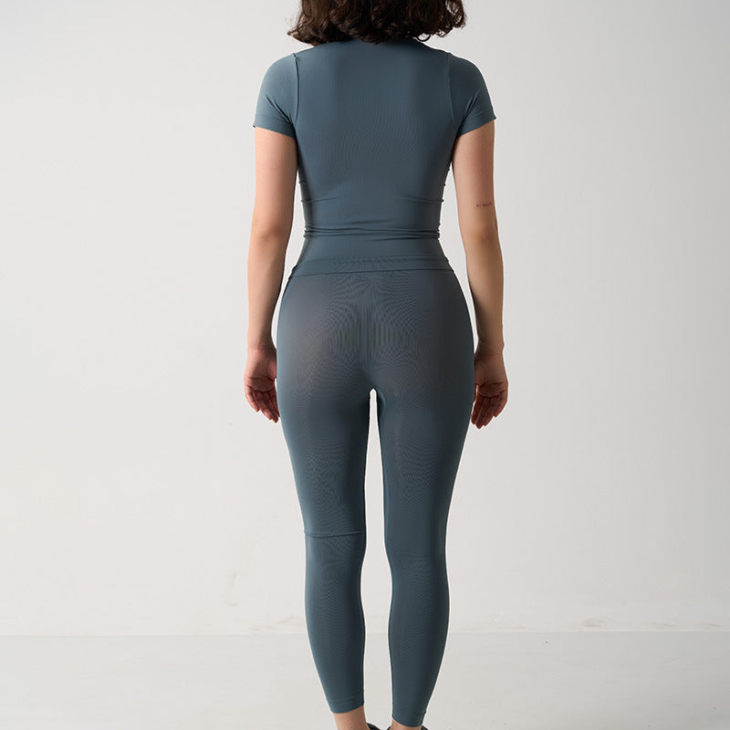 Seamless 2-Piece Activewear Set featuring a short sleeve sport t-shirt and long leggings in a muted blue color.