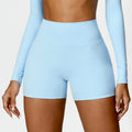 High-Waisted Tummy Control Yoga Shorts in light blue, designed for fitness with a flattering fit and comfortable waistband.