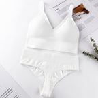 White seamless underwear set featuring a ribbed bralette and mid-waist thong, designed for comfort and breathability.