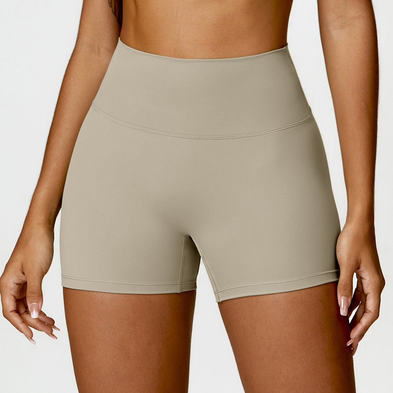 High-waisted tummy control yoga shorts in peach, designed for fitness with a flattering lift for the booty.