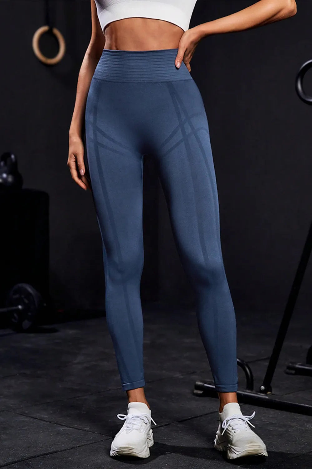Back view of women's blue fitness leggings showing fit and seam details.