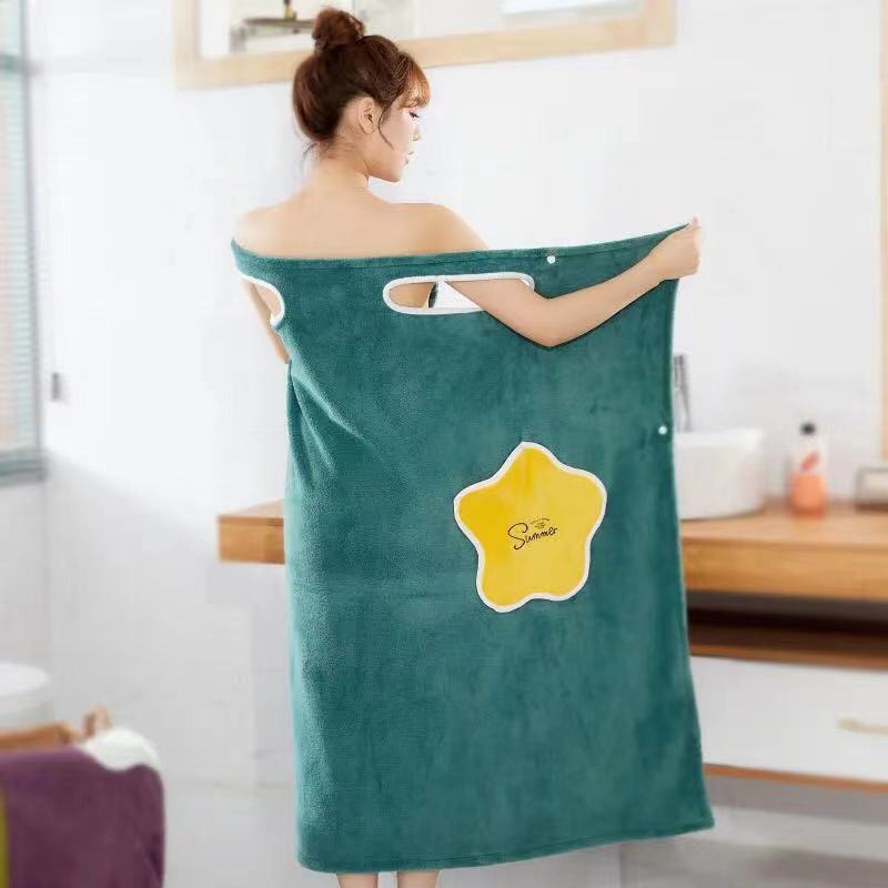 Wearable Coral Fleece Bath Towel Dress in teal with a yellow flower design, featuring shoulder cutouts and a button closure.