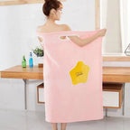 Wearable Coral Fleece Bath Towel Dress in pink, featuring a star-shaped design and shoulder openings, ideal for spa use.
