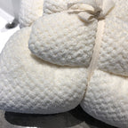 Ultra-Absorbent Coral Fleece Bath & Hand Towel Set in cream, featuring a textured pineapple grid design, tied with a ribbon.