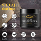 Spoon holding a dose of thick Shilajit fulvic acid resin supplement.