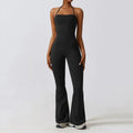 Black bell bottoms gym set for women, featuring a one-piece yoga suit with a fitted bodice and flared legs. Ideal for workout