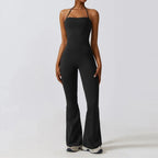Black bell bottoms gym set for women, featuring a one-piece yoga suit with a fitted bodice and flared legs. Ideal for workout