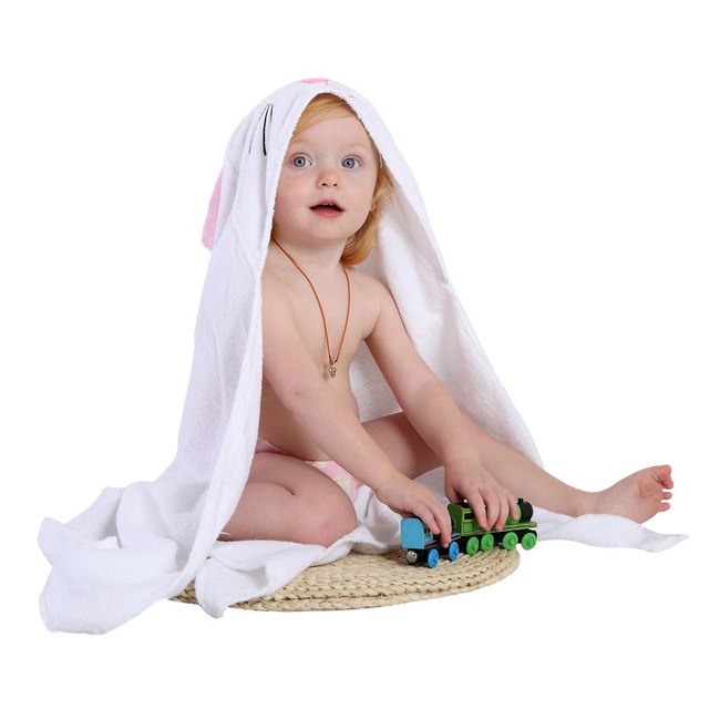 100% Premium Cotton Animal Hooded Bath Towel & Bathrobe for Toddlers featuring a child in a bunny hood, playing with toy trai