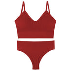 Red gathered sports vest bra and matching underwear set with thin triangle cups and adjustable straps.