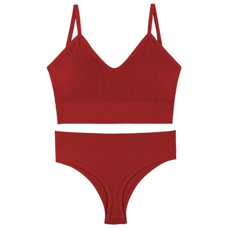 Red gathered sports vest bra and matching underwear set with thin triangle cups and adjustable straps.