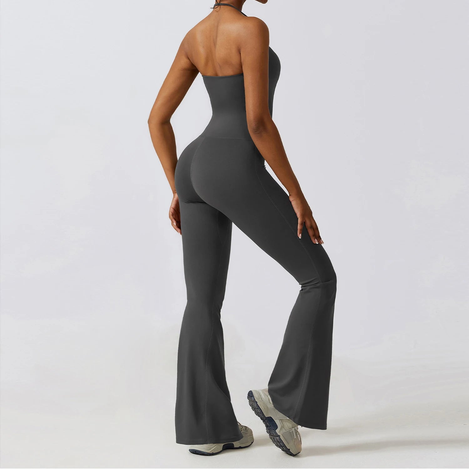Gray bell bottoms gym set for women, featuring a strapless design and flared leggings, ideal for workouts and yoga.