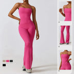 Pink bell bottoms gym set for women, featuring a one-piece yoga suit with a fitted bodice and flared legs, ideal for workouts