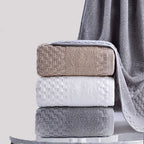 Premium Bamboo Charcoal Coral Velvet Bath Towel set in beige, white, and gray, showcasing ultra-absorbent texture.
