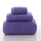 Premium 100% Cotton Thickened Bath Towel Set in purple, featuring three towels of varying sizes stacked neatly.