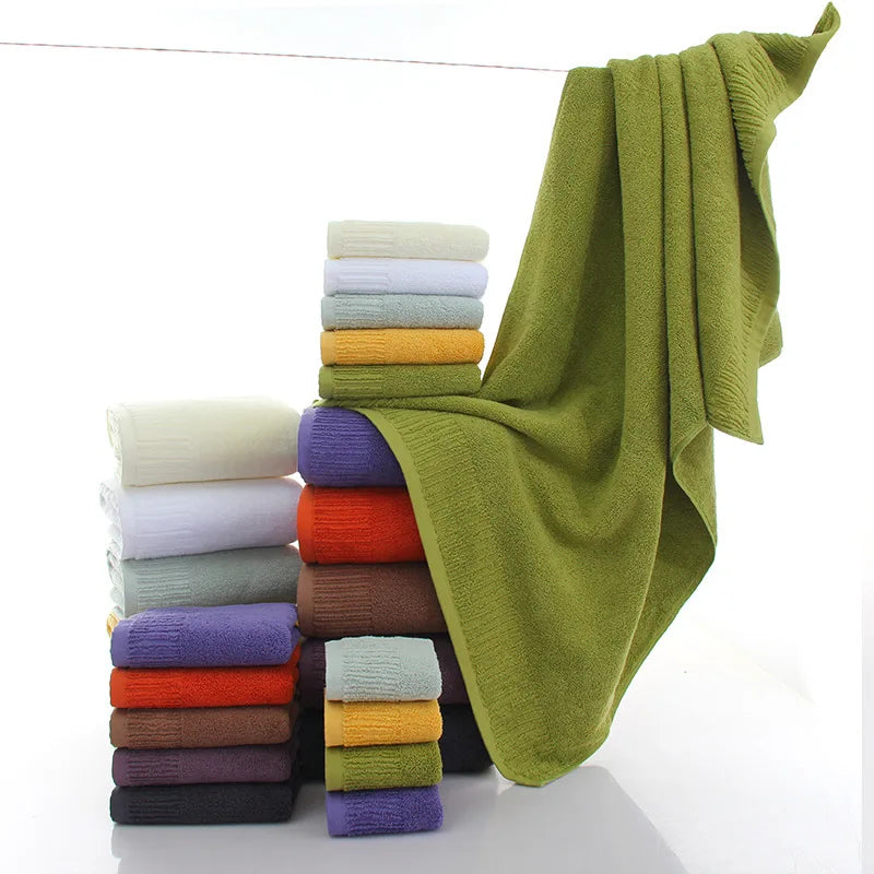 Premium 100% Cotton Thickened Bath Towel Set – 3-Piece Luxury Collection featuring stacked towels in various colors with a gr