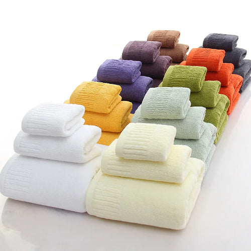 Premium 100% Cotton Thickened Bath Towel Set – 3-Piece Luxury Collection featuring various colors stacked neatly.
