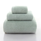 Premium 100% Cotton Thickened Bath Towel Set in soft green, featuring three luxurious towels stacked neatly.