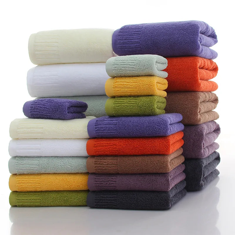 Premium 100% Cotton Thickened Bath Towel Set – 3-Piece Luxury Collection featuring a variety of colorful stacked towels.