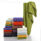 Premium 100% Cotton Thickened Bath Towel Set – 3-Piece Luxury Collection featuring stacked colorful towels and a hanging towe