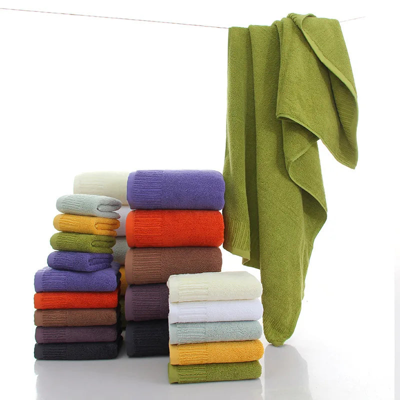 Premium 100% Cotton Thickened Bath Towel Set – 3-Piece Luxury Collection featuring stacked colorful towels and a hanging towe
