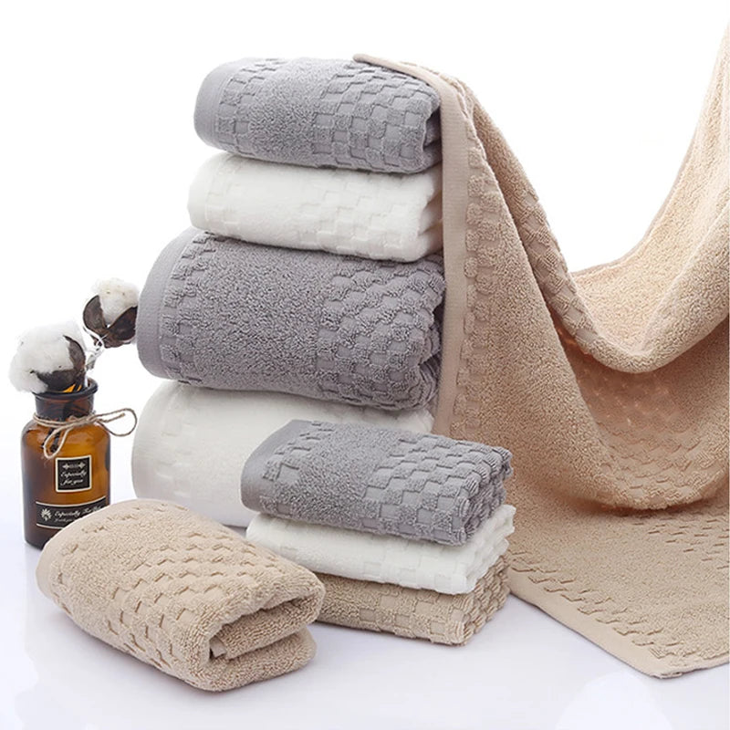 Premium Bamboo Charcoal Coral Velvet Bath Towel set in neutral colors, featuring ultra-absorbent texture and soft design.