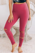 Front view of rose red high waisted leggings with ripped cut-out design.